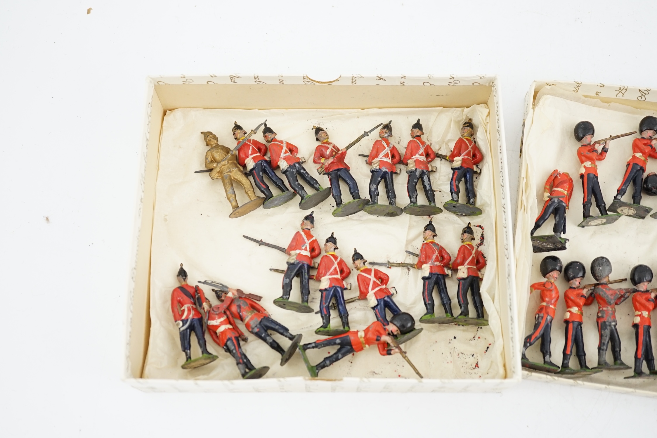 Thirty-five early twentieth century Britains lead infantry soldiers; twenty Grenadier guards in busbys, and fifteen understood to be East Kent Regiment soldiers